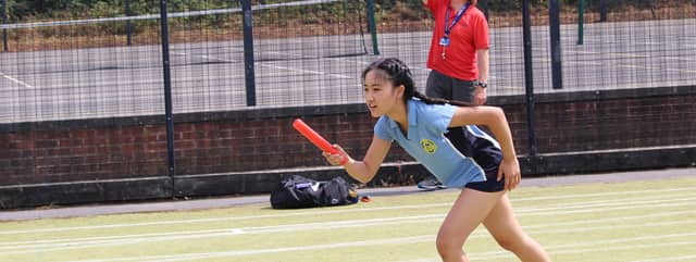 Students playing sport on a school field