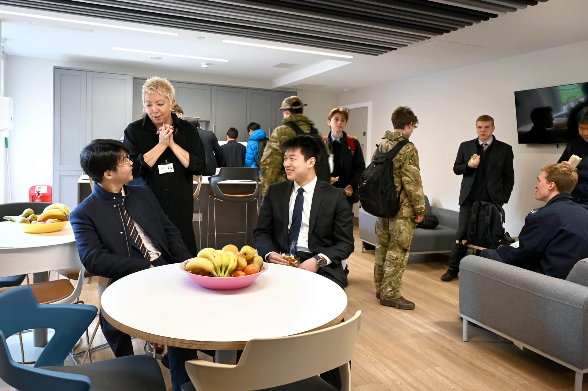 Abingdon School boarders and staff in a boarding-house common room