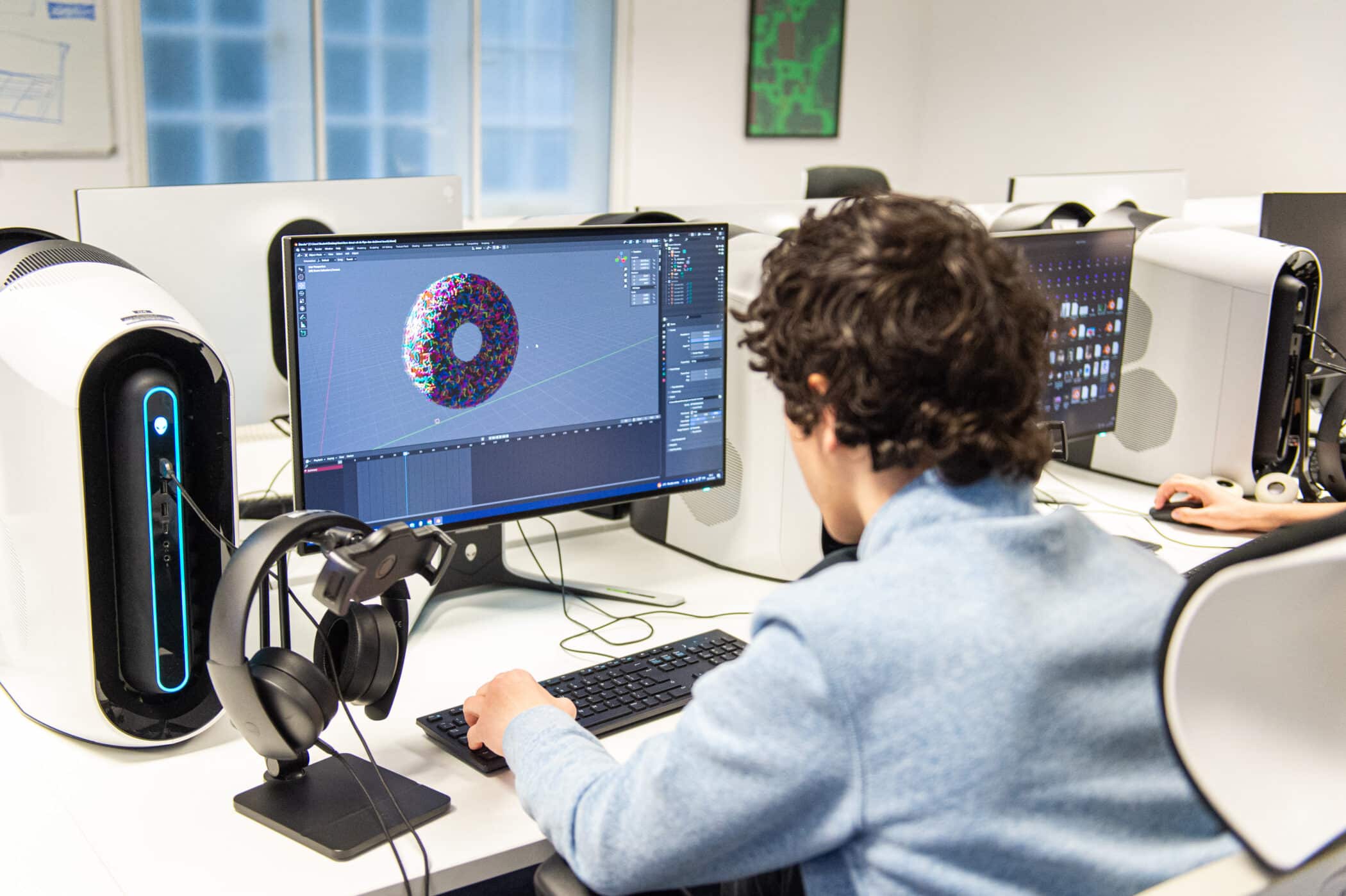 A pupil working with 3D design software in the ACS Hillingdon digital arts suite