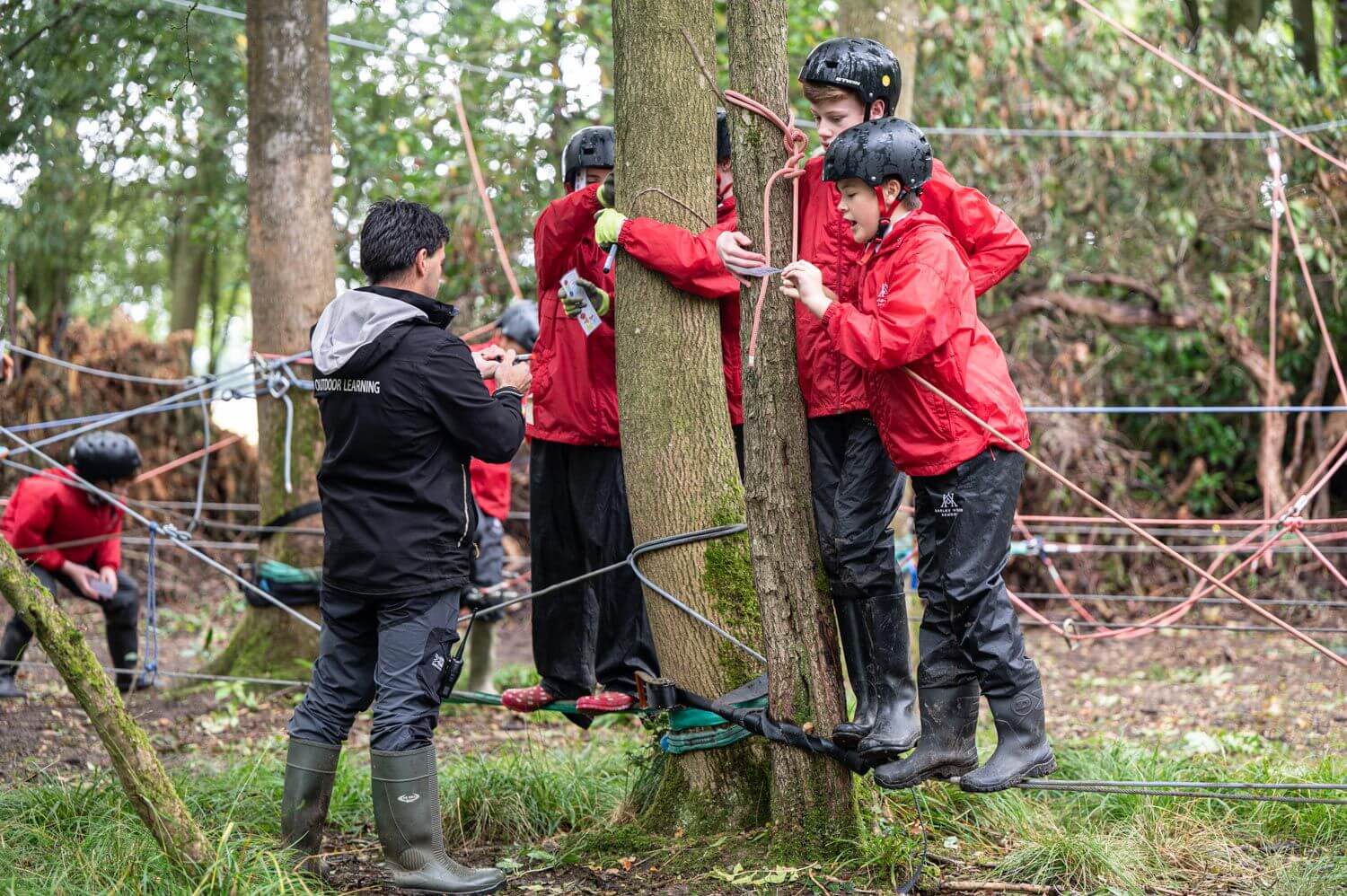 Akeley Wood Senior School pupils taking part in outdoor learning among the trees
