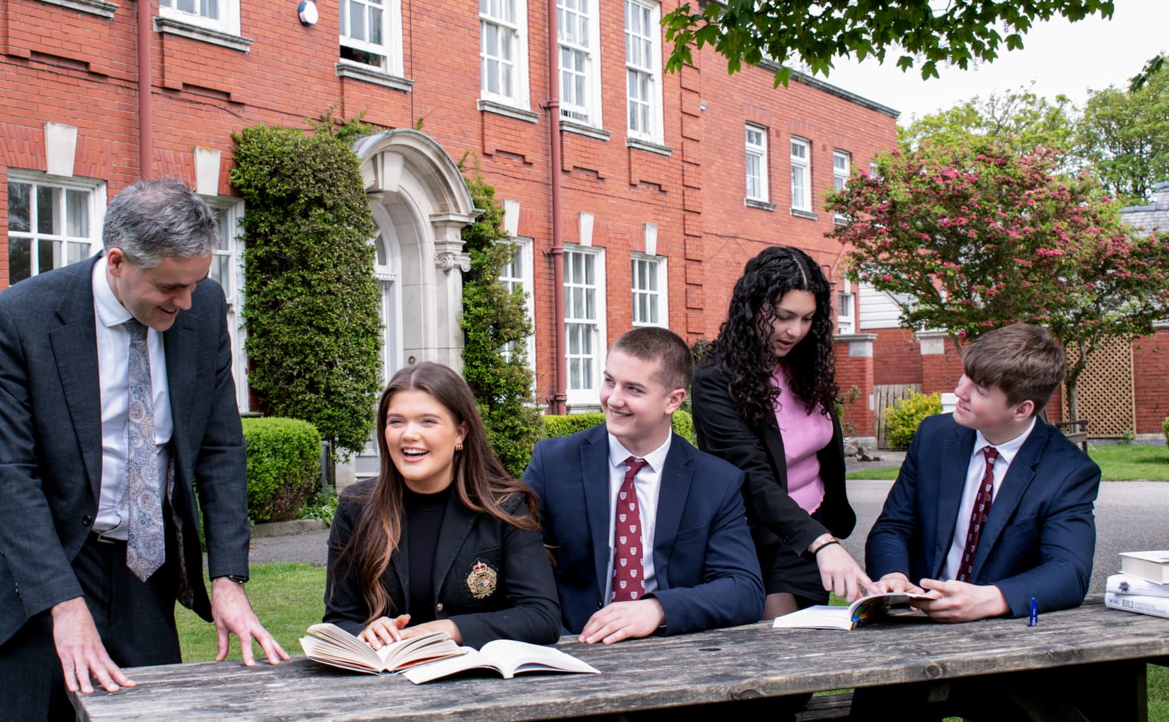 Exterior courtyard and historic red-brick Senior School building at AKS Lytham