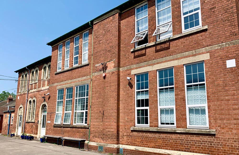Exterior of the red-brick Al-Ashraf Secondary School for Girls building in Gloucester