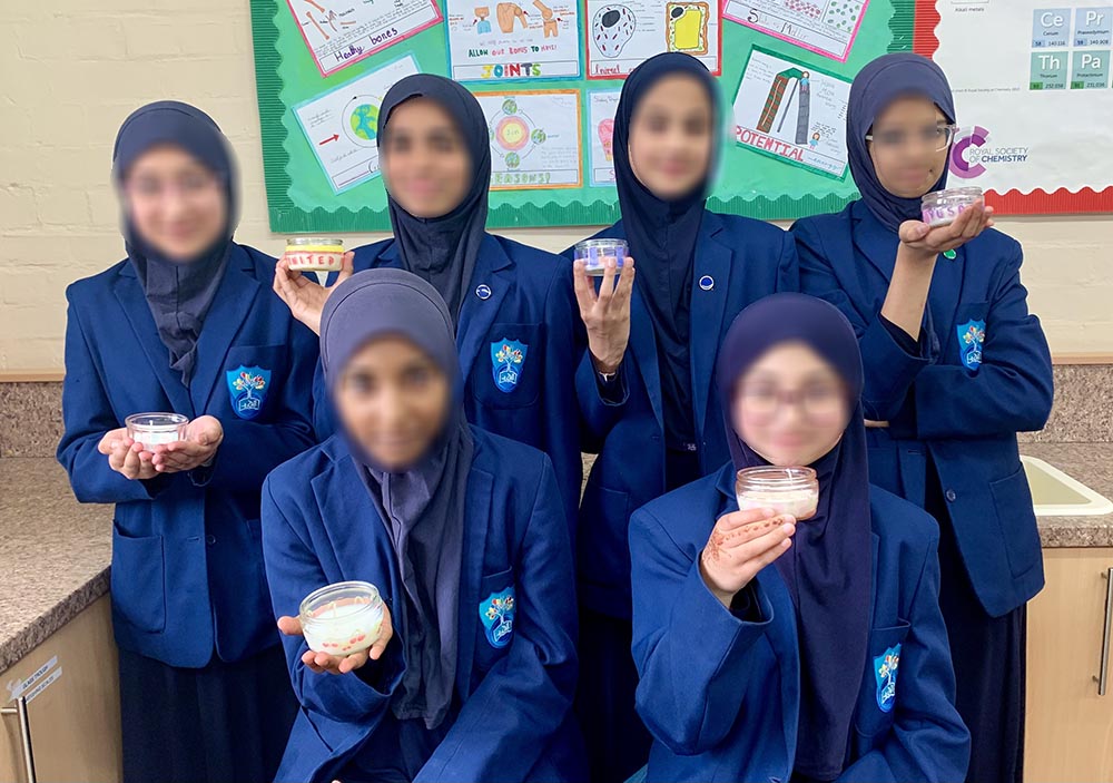 Al-Ashraf pupils displaying work made during an Eco Club upcycling activity