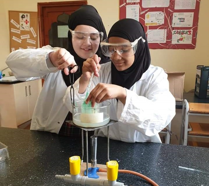 Al Islah pupils carrying out a practical science experiment