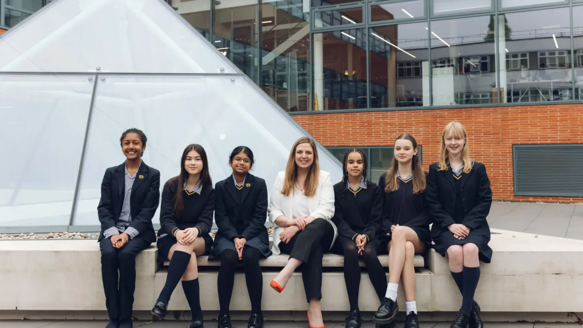Group seated outside a modern building