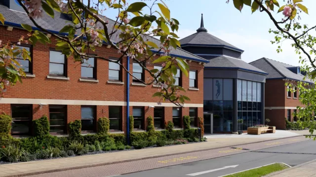 Outside view of a computer-generated version of the school | 360 virtual school tour
