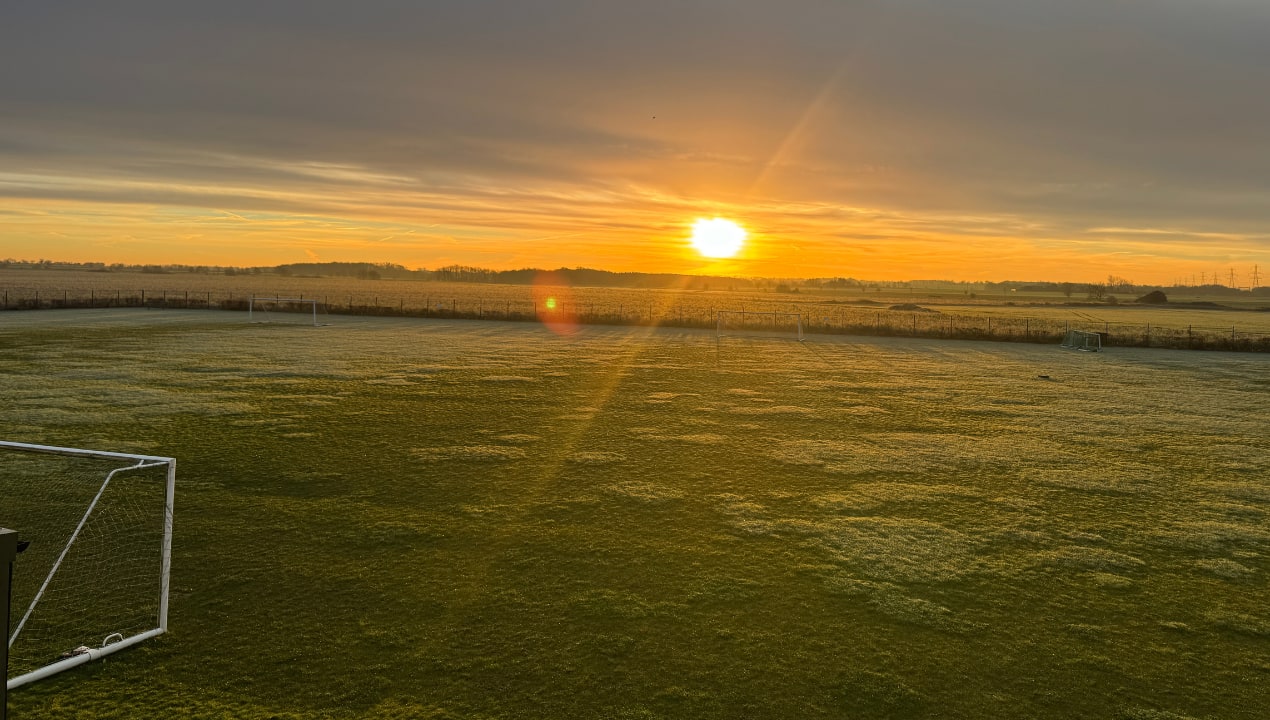 Playing fields at OneSchool Global Biggleswade Campus at sunrise