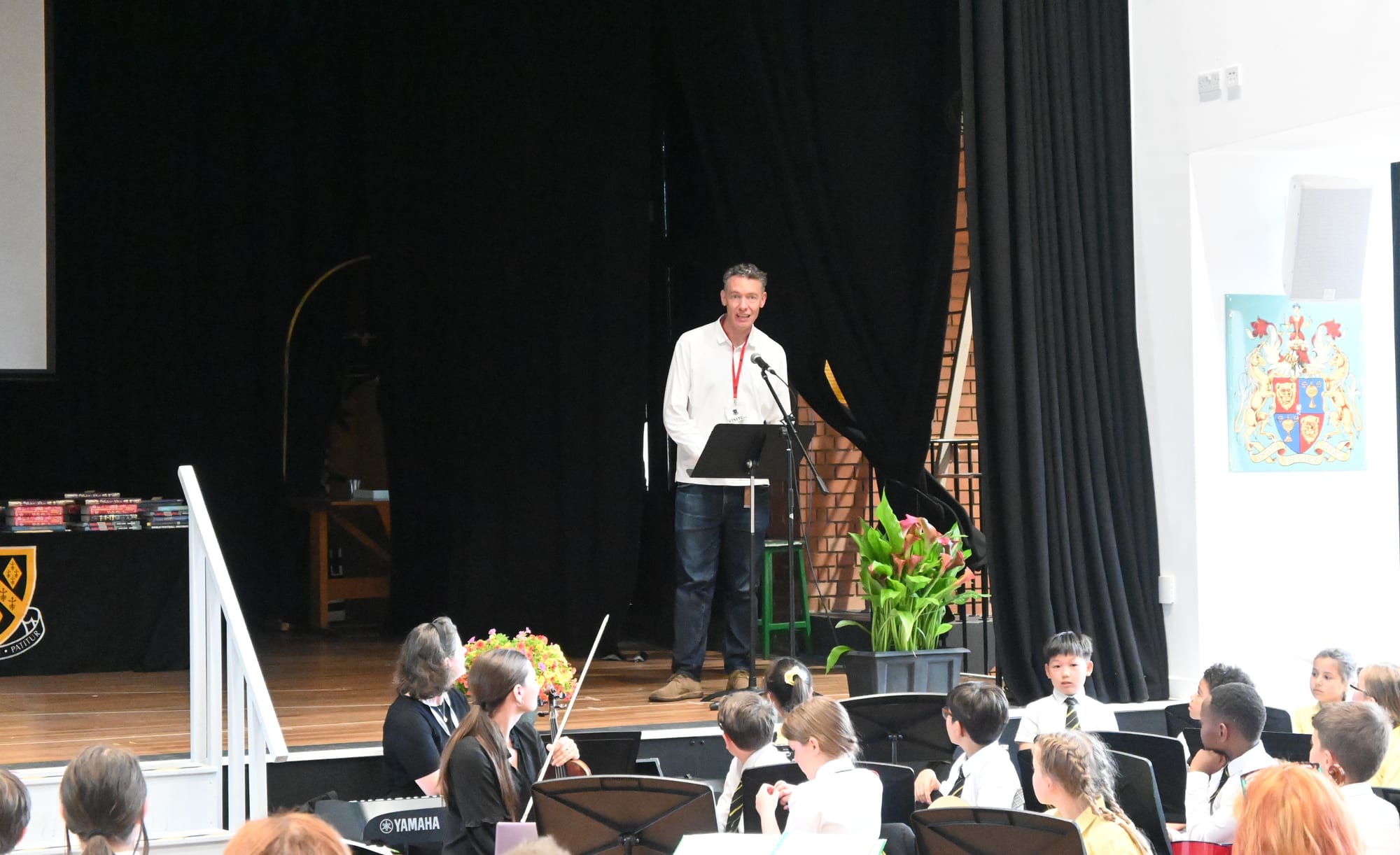 Guest speaker Chris Conlan (OS 1993) speaking to the audience at the 2026 Junior School Prize Giving