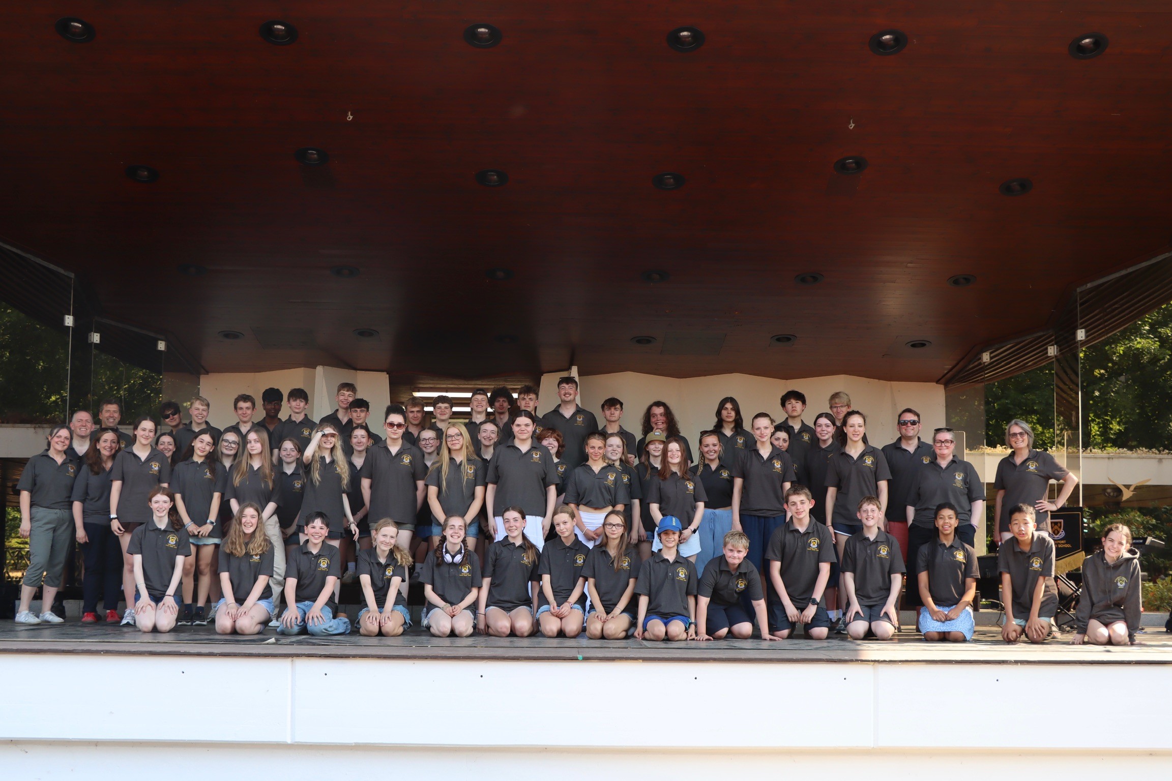 Pupils and staff pose for a photo on stage during the 2026 music tour to the Black Forest, Germany